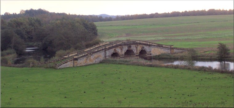 The ornamental 'New River Bridge' at Castle Howard seen from the field by The Temple