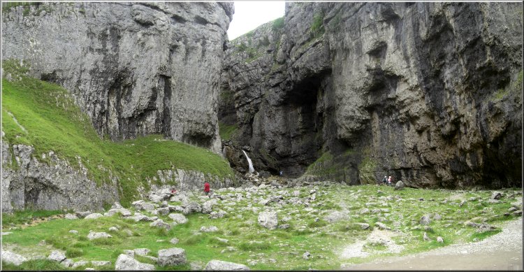 The mouth of Gordale Scar with the waterfall in the distance