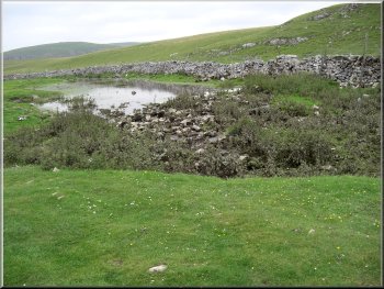 The stream from Malhsm tarn disappears underground here