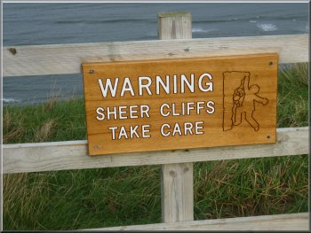 One of many signs on the cliff top