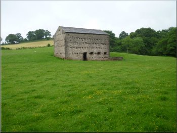 Large stone barn by the path
