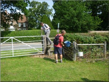 Crossing the stile to the road in Skipwith village