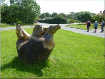 Horses head sculpture on the village green in Skipwith