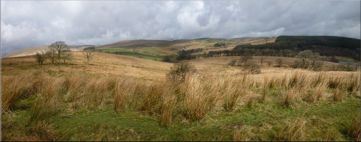 Looking north east from the path along the old railway across the valley of the River Hodder upstream of the reservoir