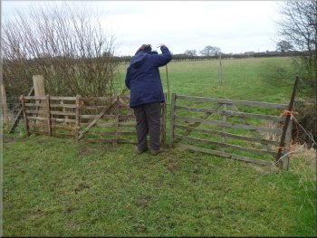 Withdrawing the steel pin to open the gate