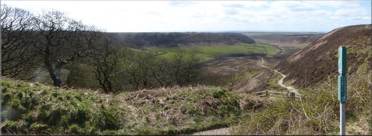 Looking down into the Hole-of-Horcum from the stile at the hairpin bend in the A169