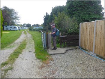 Gate where the footpath goes around the caravan site