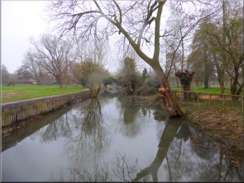 Watercourse crossing the park seen from the road bridge