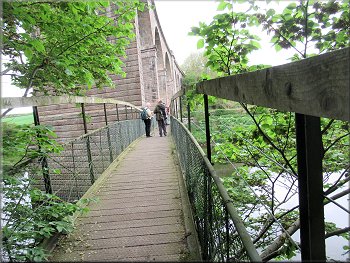 Crossing the River Teviot on the footbridge