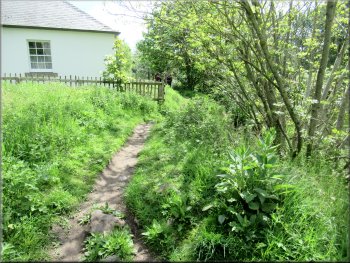 The path passed between this house and the drop to the river