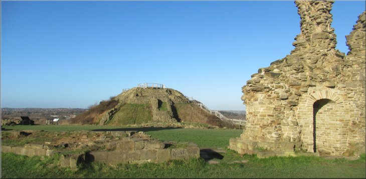 Looking across the castle site to the motte where the shell keep once stood