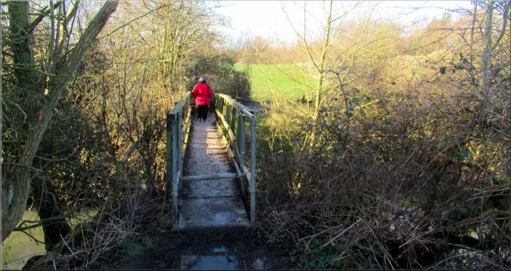 Crossing the bridge over Pugney's Drain back into the Pugneys Country Park