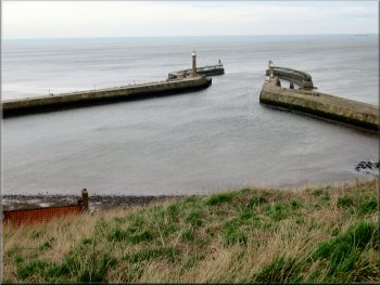 The arms of Whitby harbour seen from the churchyard